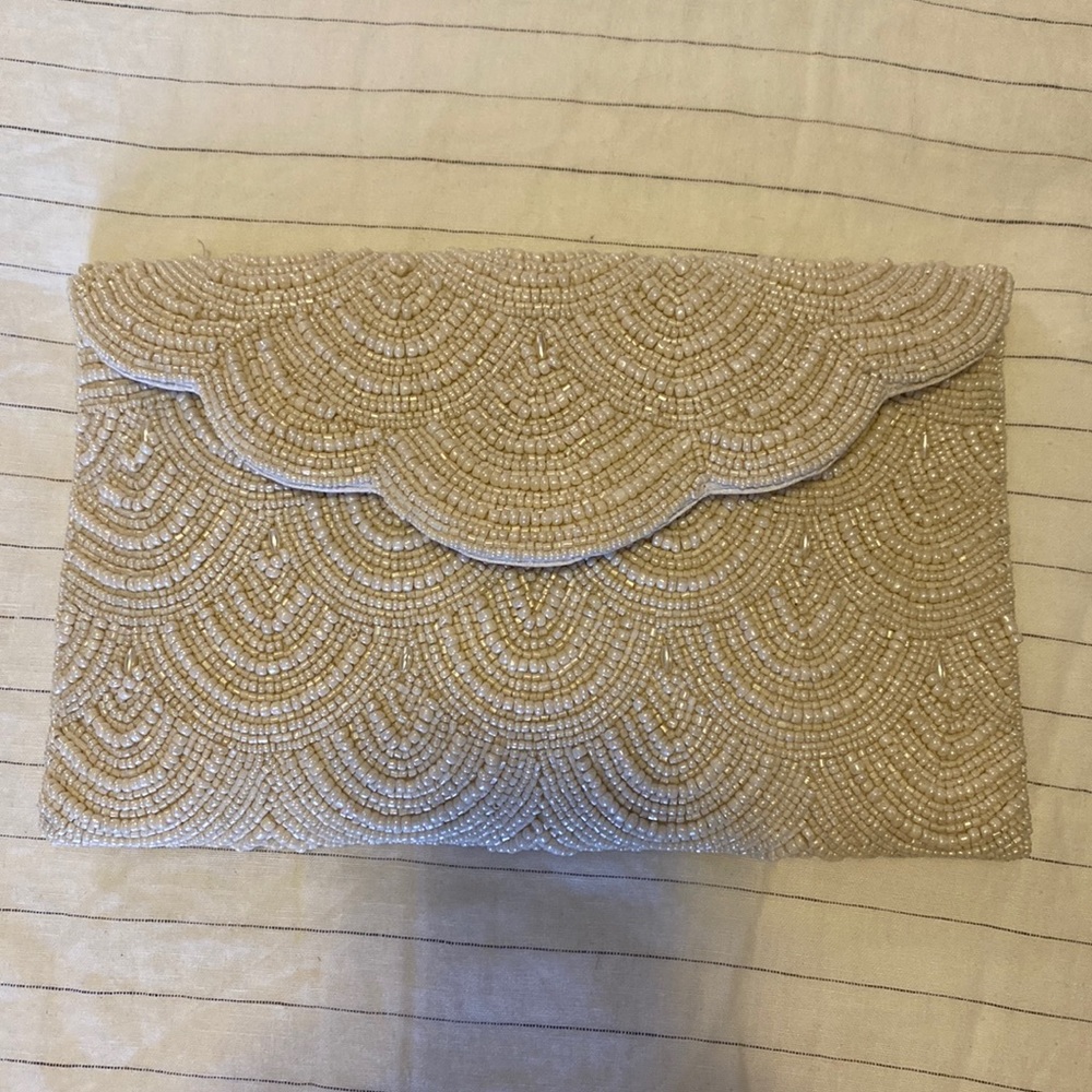 From St Xavier Ivory Chevy Beaded Clutch